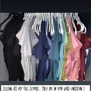 Selling Figs scrubs tops for $28, bottoms for $38